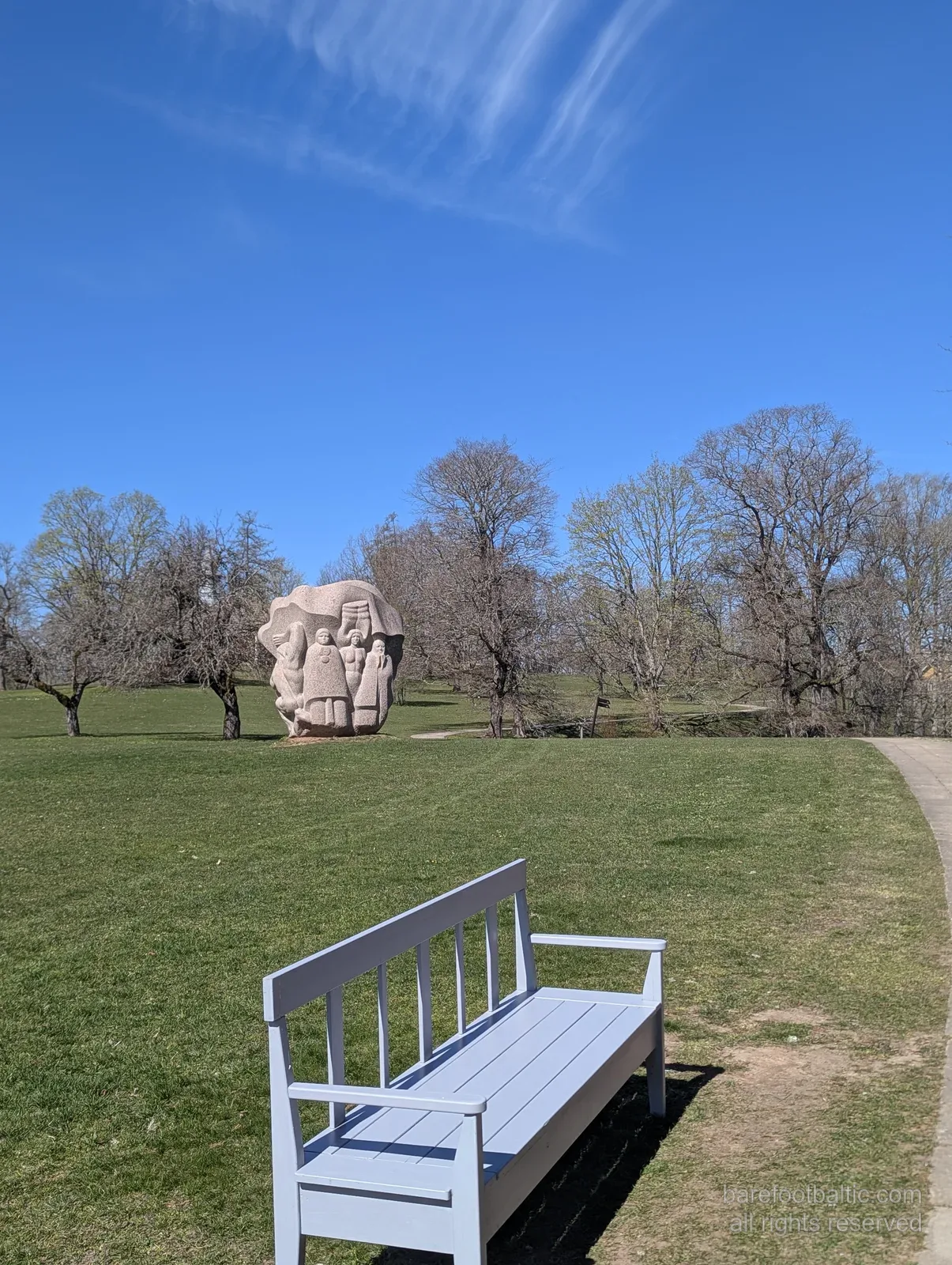 A granite sculpture and bench at Dainu Kalns, the Hill of Dainas at Turaida