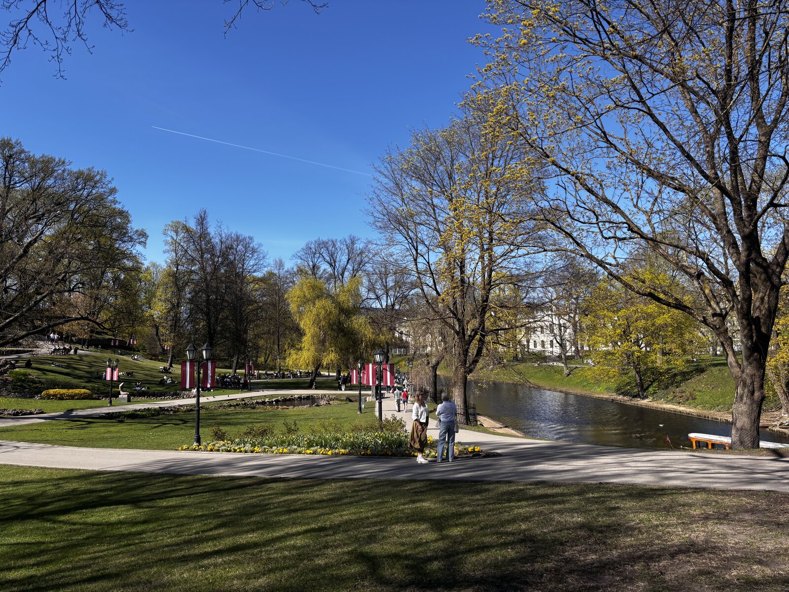 Bastejkalns Canal Park in spring near the Freedom Monument, Riga