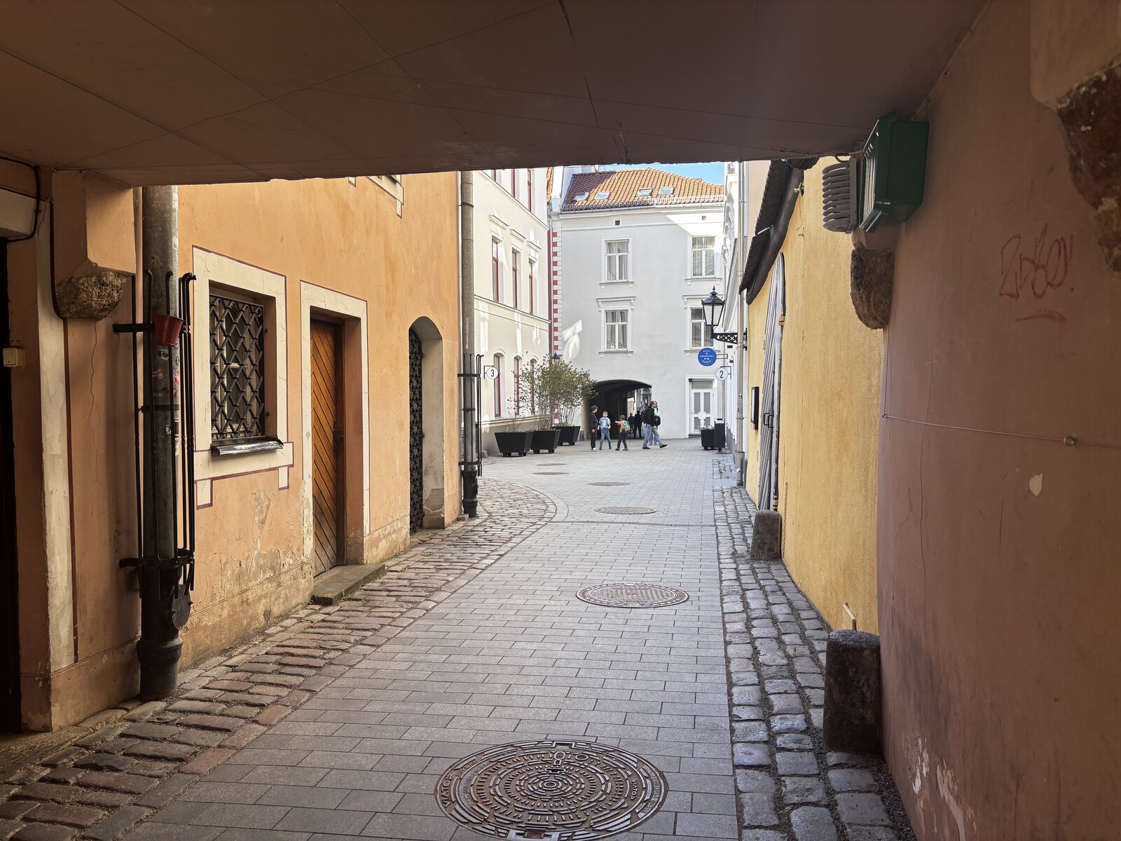Cobbled inner passage of Konventa Sēta, the medieval convent courtyard in Riga Old Town