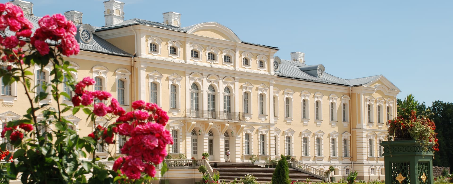 Rundāle Palace baroque façade framed by summer roses