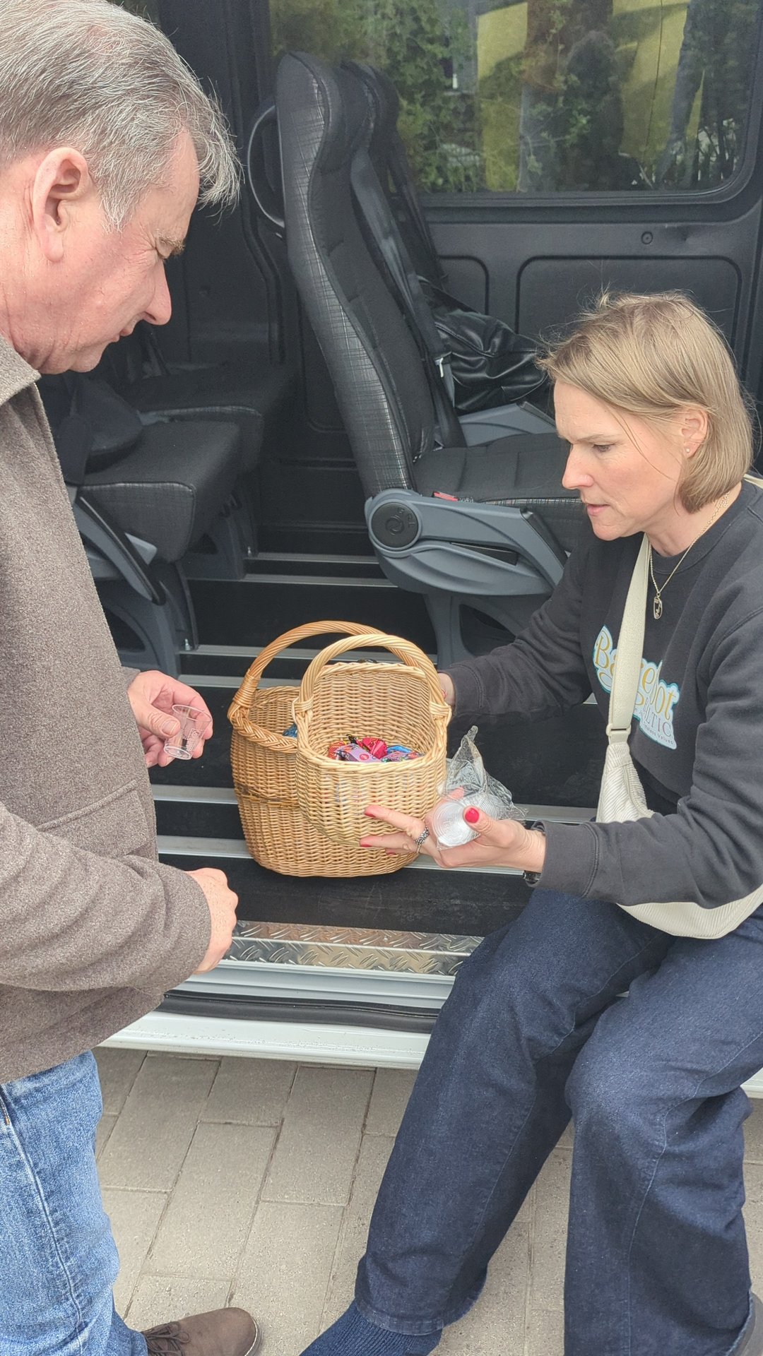 Daiga handing out snacks in the Barefoot Baltic van