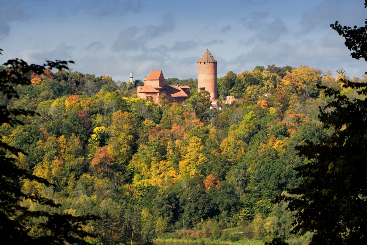 Cēsis Castle ruins in autumn forest, the second castle in the Sigulda day