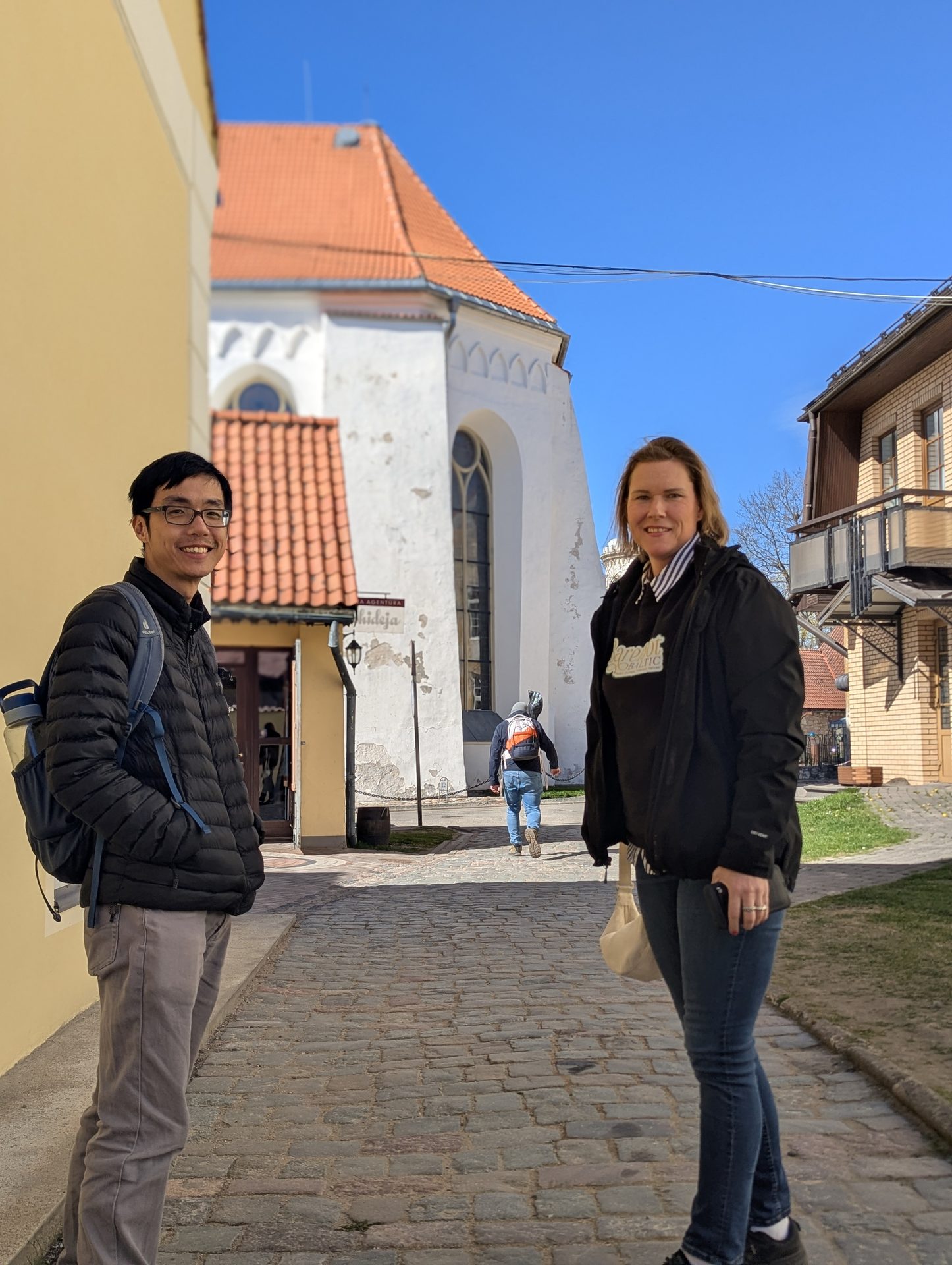 Guests on a cobblestone street near Cēsis Medieval Castle