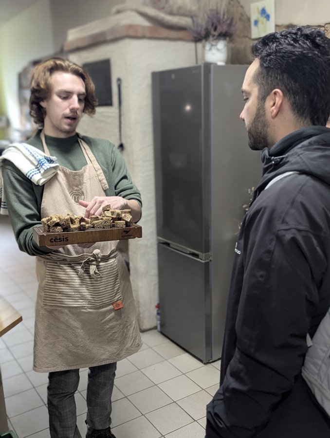 The baker at Česu Maize kneading a loaf of traditional rye bread