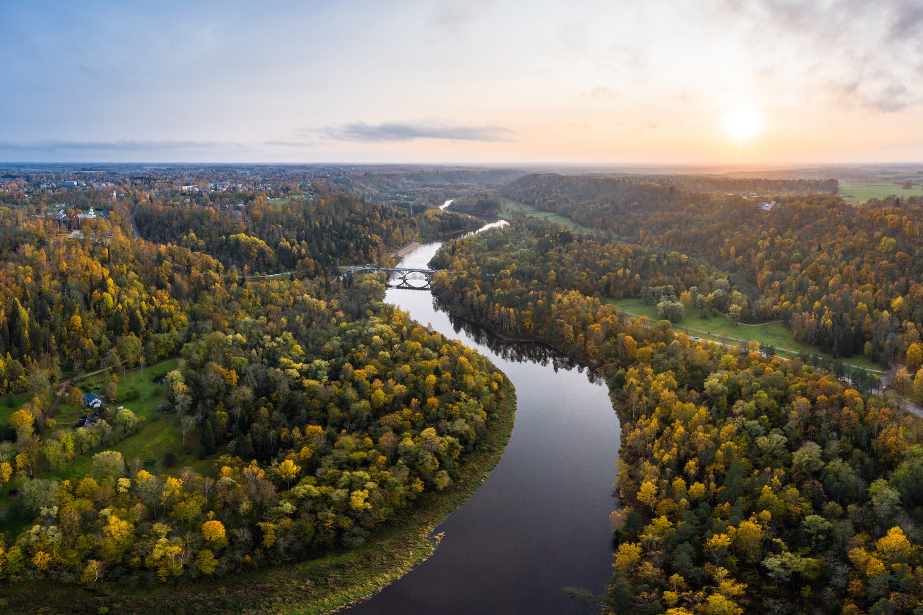 The Gauja river at sunset, cutting through autumn forests